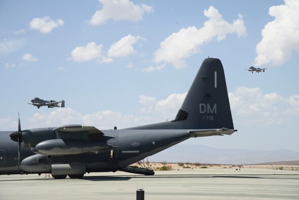 Pictured above are two two aircraft preparing to land on a runway in the desert.