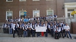 Alumni from the United States Coast Guard Academy Class of 1981 commemorate their fallen classmate Lt. j.g. Keith Culver with the dedication of an accessibility ramp entering Billard Hall on campus, Friday Oct. 1, 2021. The ramp is the first project in a new accessibility initiative being undertaken by the Class of 1981. (U.S. Coast Guard courtesy photo by Austin Gao)