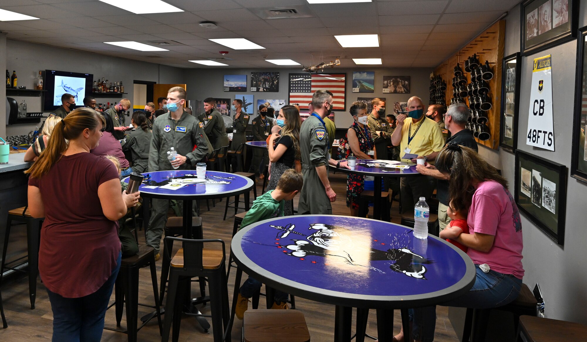 Members of the 48th Flying Training Squadron get their first glimpse at the new heritage room for their squadron Oct. 8, 2021, on Columbus Air Force Base, Miss. Heritage rooms serve as a reminder of the lineage of the previous members who served in that squadron to include past commanders, highly awarded pilots, missing in action, prisoners of war and more. (U.S. Air Force photo by Airman 1st Class Jessica Haynie)