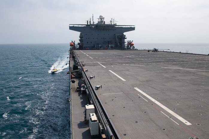 A pilot boat approaches the Expeditionary Sea Base USS Hershel "Woody" Williams (ESB 4) as it pulls into port in Maputo, Mozambique, Oct. 15, 2021.