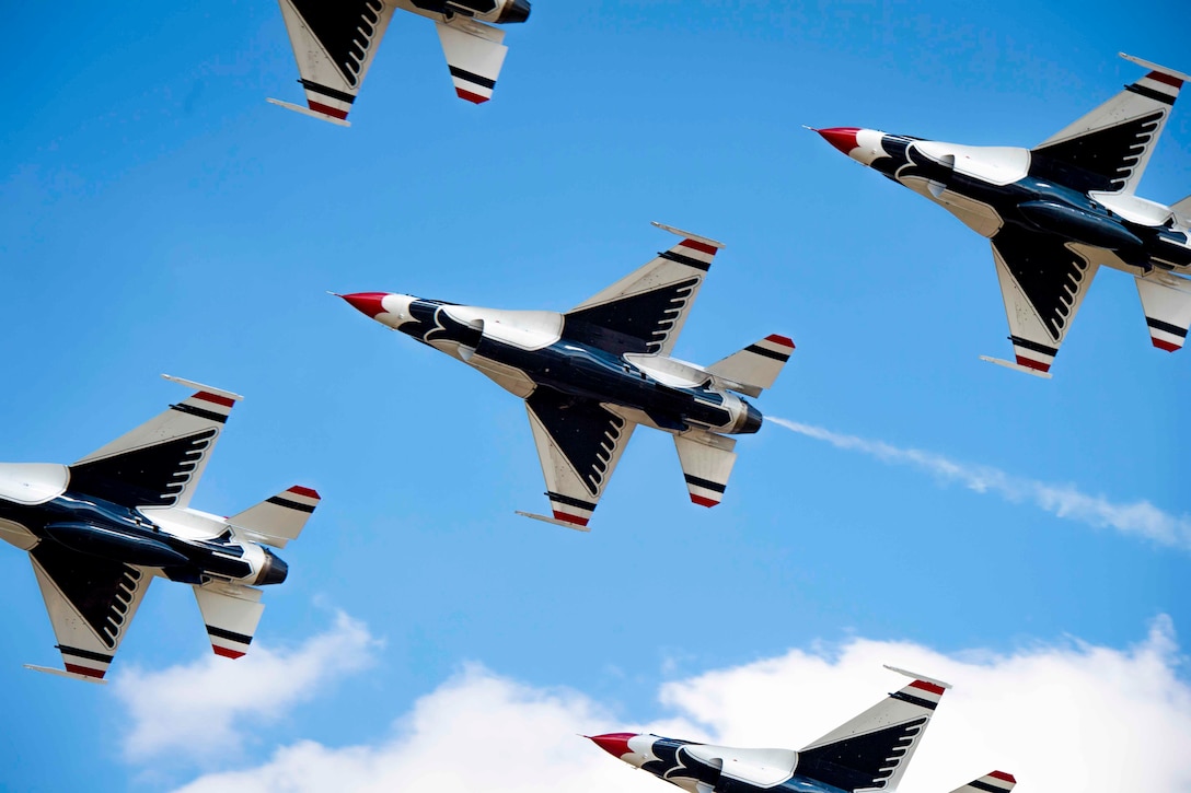 Air Force aircraft fly in formation.