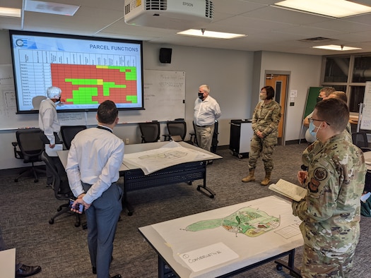 Students in the Air Force Institute of Technology Civil Engineer School’s comprehensive planning development (WENG 520) course work in teams to develop district plans for areas around Wright-Patterson AFB and then present their work to base personnel and leadership. (Contributed Photo)