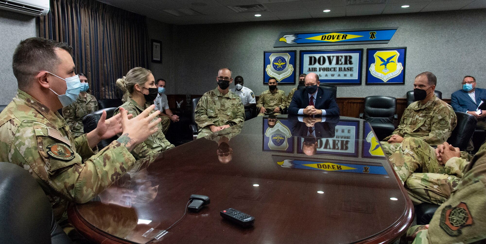 Staff Sgt. Kevin Garcia, left, 436th Security Forces Squadron Phoenix Raven team leader, speaks with U.S. Sen. Chris Coons about his involvement during Operation Allies Refuge missions at Dover Air Force Base, Delaware, Oct. 15, 2021. Coons visited the base to meet with Airmen from various career fields who deployed during OAR. He also spoke with personnel assigned to the 436th Civil Engineer Squadron fire department. (U.S. Air Force photo by Roland Balik)