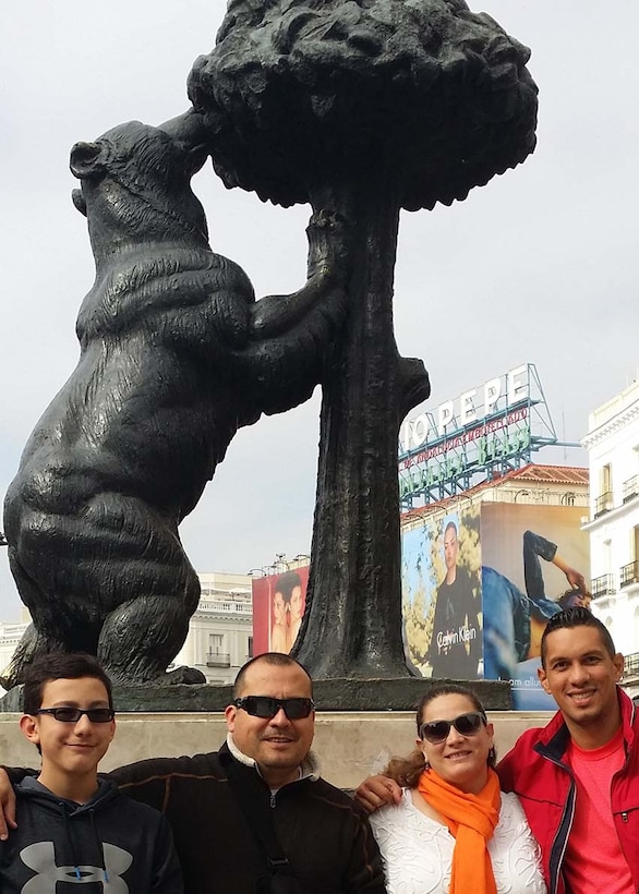 U.S. Army Corps of Engineers Program Analyst Sondra Abanto poses with her family in front of a statue in Madrid, Spain in October 2016.