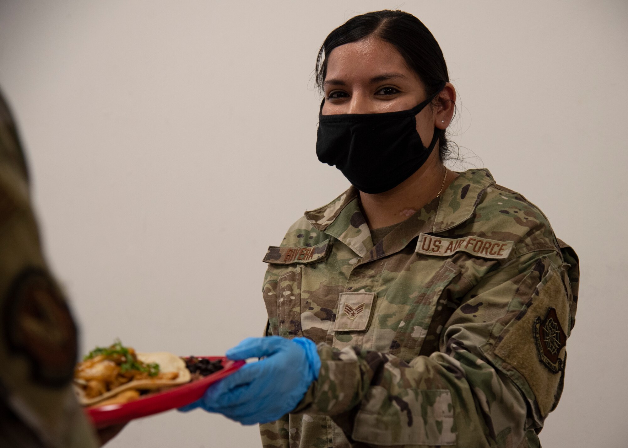 U.S. Air Force Senior Airman Martha Rivera, 6th Force Support Squadron Food Services journeyman, serves refreshments during a Hispanic Heritage Month celebration at MacDill Air Force Base, Florida, Oct. 14, 2021.