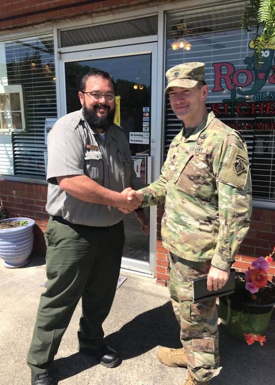 Cordell Hull Lake Park Ranger Luke Navarro shakes hands with a USACE Soldier
