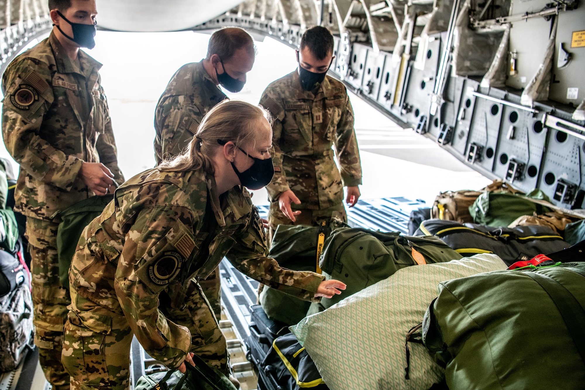 Airmen at Travis Air Force Base, California, prepare for a C-17 Globemaster III mission supporting the Afghanistan evacuation, Aug. 24, 2021. The 349th AMW is providing rapid global mobility to assist the U.S. State Department in the safe evacuation of Americans and allied civilian personnel from Afghanistan. (U.S. Air  Force photo by Master Sgt. Jose B. Aquilizan)