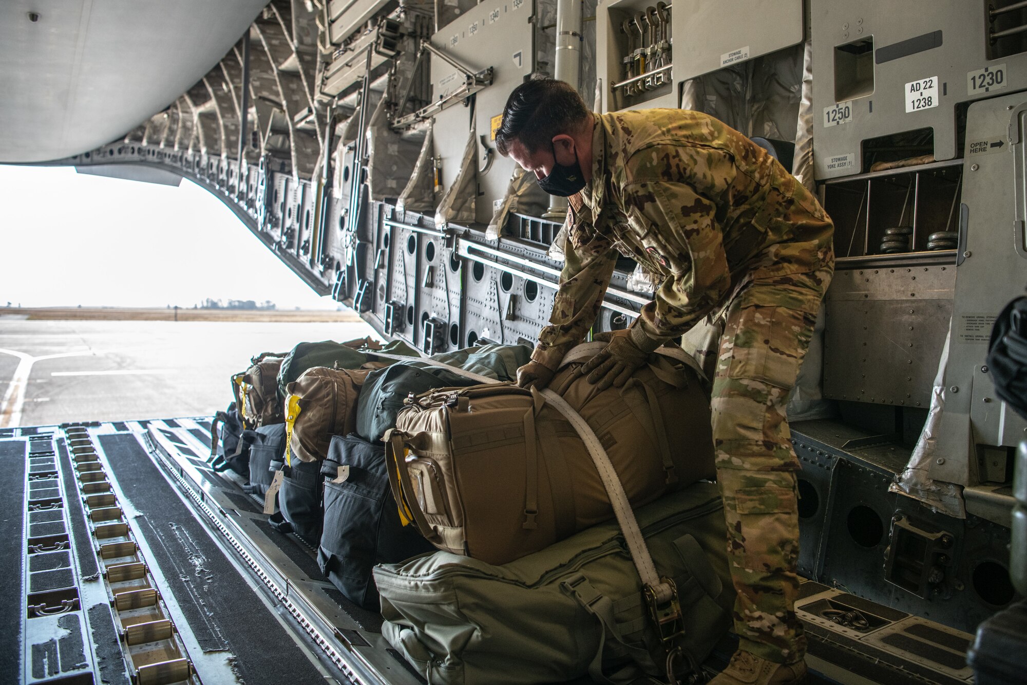 Airmen at Travis Air Force Base, California, prepare for a C-17 Globemaster III mission supporting the Afghanistan evacuation, Aug. 24, 2021. The 349th AMW is providing rapid global mobility to assist the U.S. State Department in the safe evacuation of Americans and allied civilian personnel from Afghanistan. (U.S. Air  Force photo by Master Sgt. Jose B. Aquilizan)
