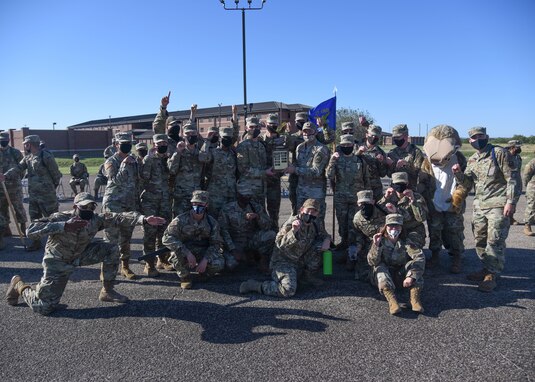The 315th Training Squadron drill team poses with the trophy for best drill team following the 17th Training Group drill competition