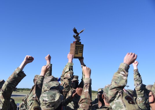 The 315th Training Squadron drill team holds the trophy for best drill team in the air following the 17th Training Group drill competition
