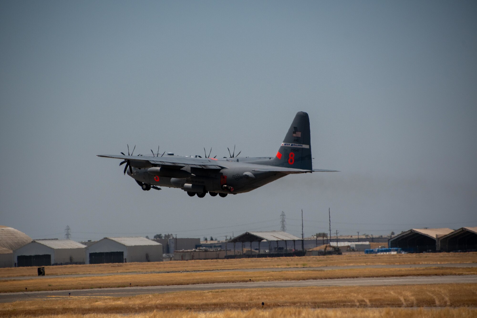 Air National Guard C-130 MAFFS 8 out of Reno, Nev., launches July 14, 2021, from CAL FIRE Air Tanker Base, McClellan Park, Calif. The Defense Department, through the commander, U.S. Northern Command (USNORTHCOM), supports the National Interagency Fire Center in fighting wildfires.