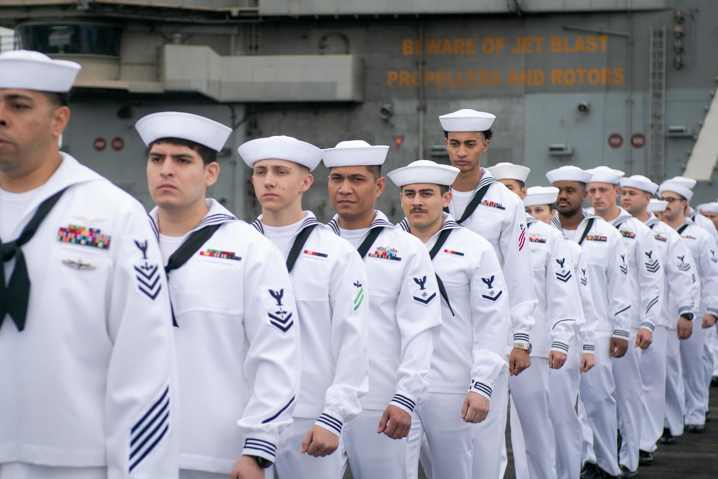 YOKOSUKA, Japan (Oct. 16, 2021) Sailors prepare to man the rails as the U.S. Navy’s only forward-deployed aircraft carrier USS Ronald Reagan (CVN 76) returns to Commander, Fleet Activities Yokosuka following a five-month deployment. During Ronald Reagan’s deployment, the ship transited 43,000 nautical miles operating in the U.S. 5th Fleet area of operations to assist with Operation Freedom’s Sentinel and Operation Allies Refuge in support of U.S. drawdown operations in Afghanistan. Ronald Reagan returned to the U.S. 7th Fleet area of responsibility and took part in multi-carrier operations, which included 15,000 Sailors from six partner nations upholding collective maritime interests in the Indo-Pacific region. (U.S. Navy photo by Mass Communication Specialist Seaman Natasha ChevalierLosada)