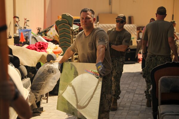 ISA TOWN, Bahrain (Oct. 16, 2021) Sailors assigned to U.S. Naval Forces Central Command and Coastguardsmen assigned to Patrol Forces Southwest Asia participate in a community relations (COMREL) event at Bahrain Mobility International (BMI) in Isa Town, Oct 16. During the COMREL, more than 80 participants from multiple commands volunteered to assist with cleanup efforts, beautification projects and interactive programs with children.