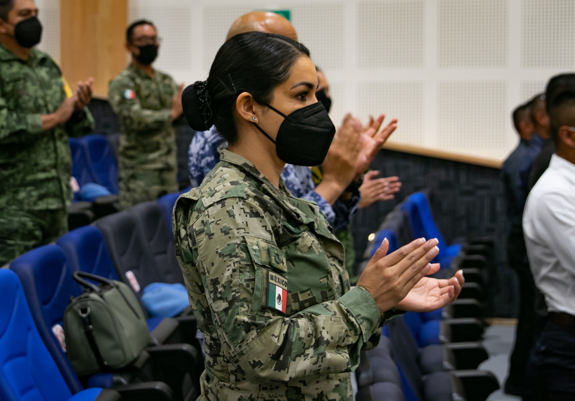 Members of the Mexican armed forces applaud a speaker during the Women in Aerospace and Society Leadership Conference at Base Aérea No.1 de Santa Lucía, Mexico, Sep. 24, 2021. The event was hosted by the Mexican Secretariat of National Defense (SEDENA) and was meant to provide a forum for women leaders to share experiences and inspire future generations of women to pursue leadership opportunities. (U.S. Air Force photo by 2nd Lt. Danny Rangel)