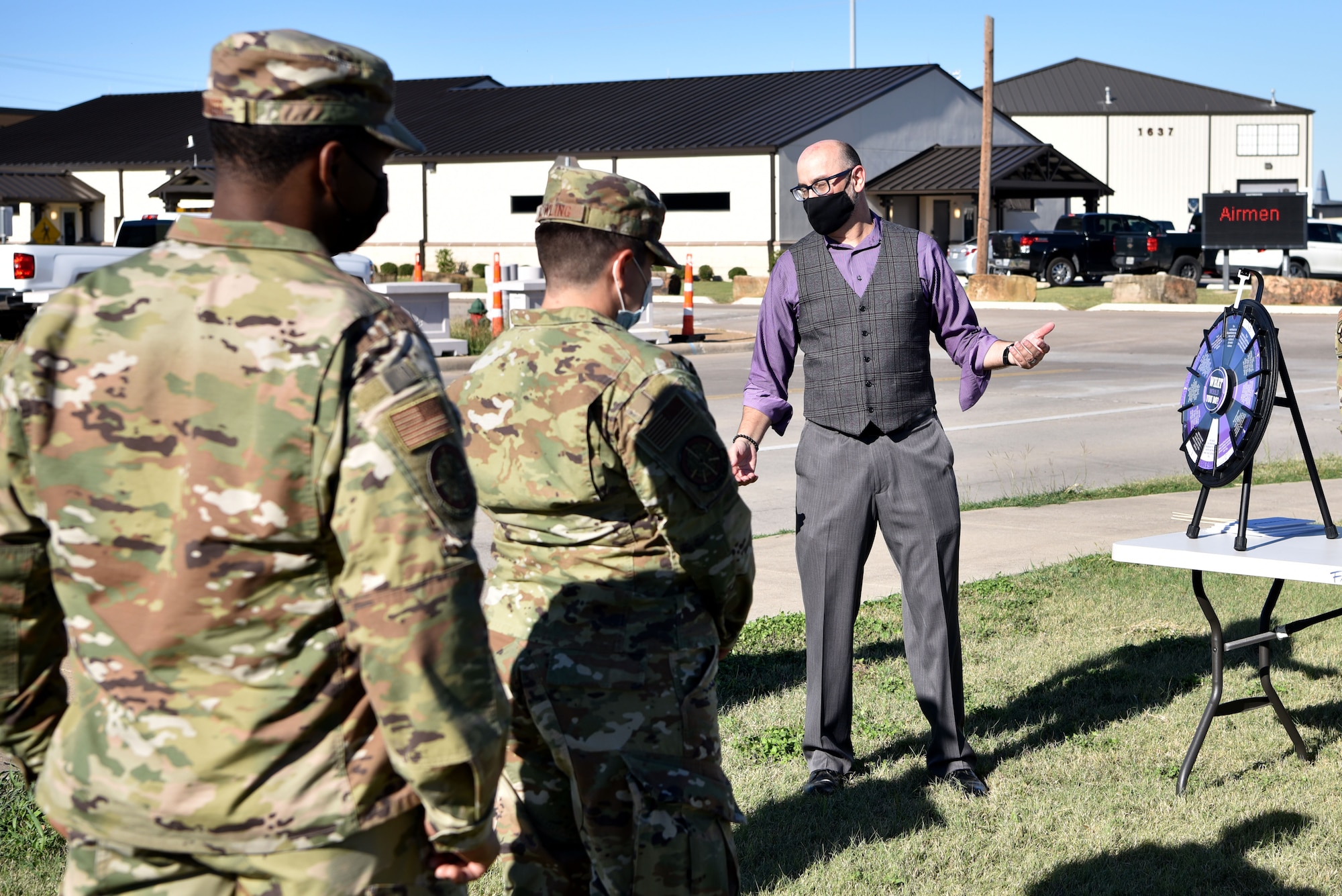 (right) Jimm Harper, 301st Fighter Wing violence prevention integrator, poses hypothetical question related to domestic violence to Airmen during a Domestic Violence Awareness event, October 16, 2021, at U.S. Naval Air Station Joint Reserve Base Fort Worth, Texas. Harper asked questions to encourage conversation and to promote approaches for reacting to potential abuse. (U.S. Air Force photo by Staff Sgt. Randall Moose)
