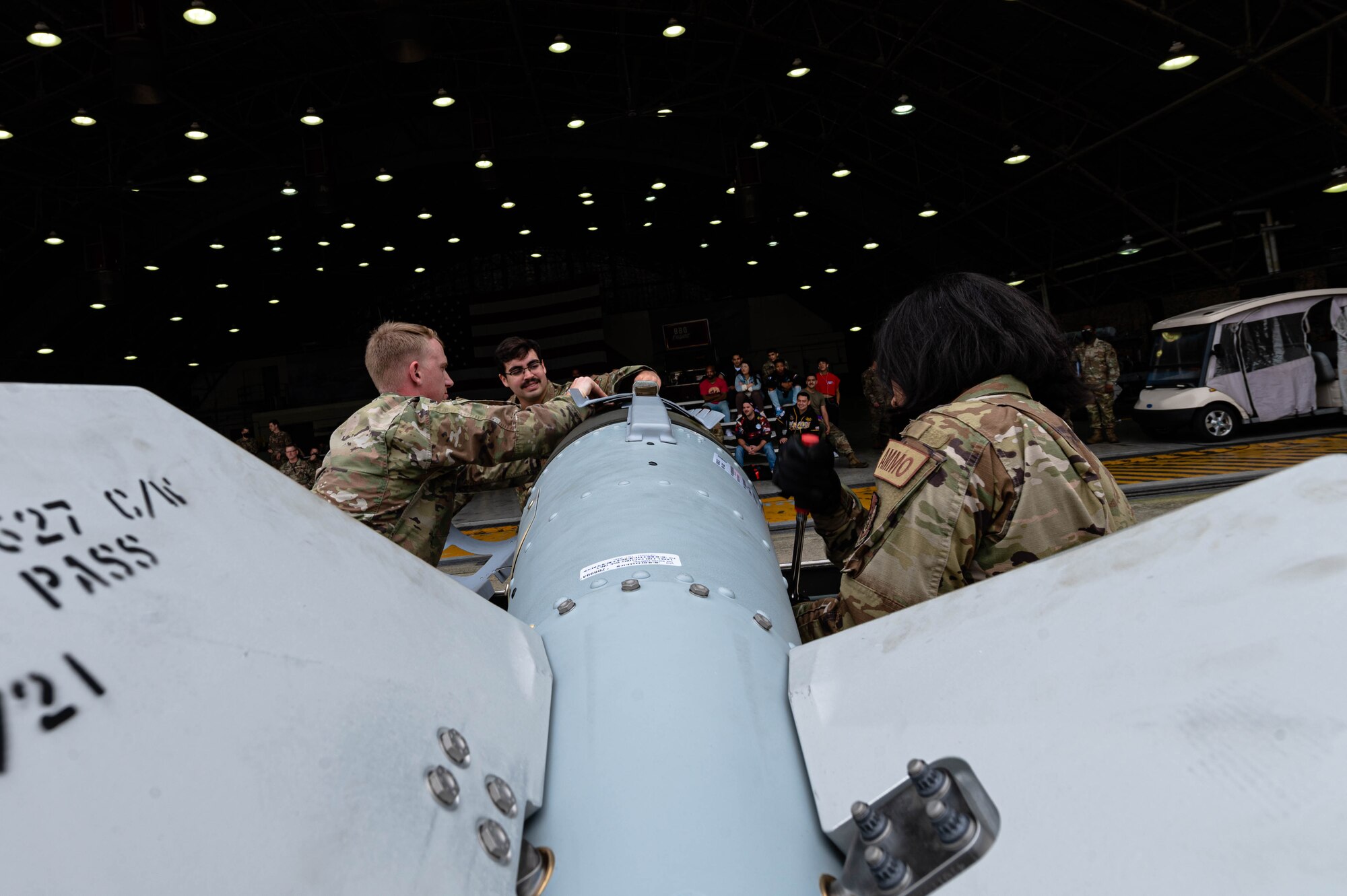 Airmen from the 51st Maintenance Group build a munition at the 3rd quarter load competition