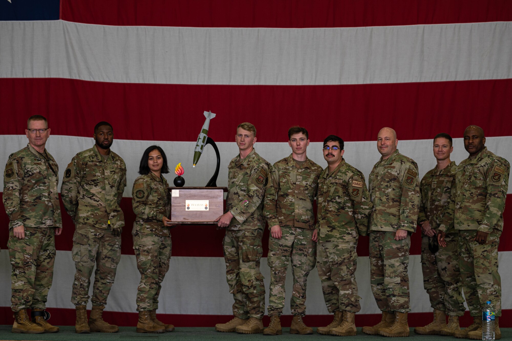Airmen from the 51st Munitions Squadron receive an award at the 3rd quarter load competition