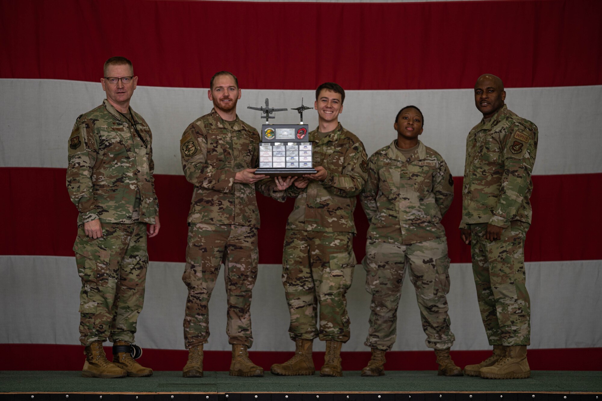 Airmen from the 25th Aircraft Maintenance Unit receive an award at the 3rd quarter load competition