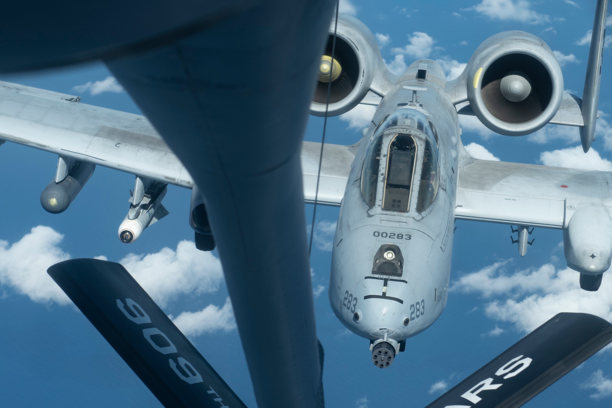 A U.S. Air Force A-10 Thunderbolt II from the 51st Fighter Squadron approaches a 909th Refueling Squadron KC-135 Stratotanker for aerial refueling over the Pacific Ocean Oct. 14, 2021. The A-10 was designed to target armored vehicles and tanks, and provide close air support for friendly ground troops. (U.S. Air Force photo by Senior Airman Jessi Monte)