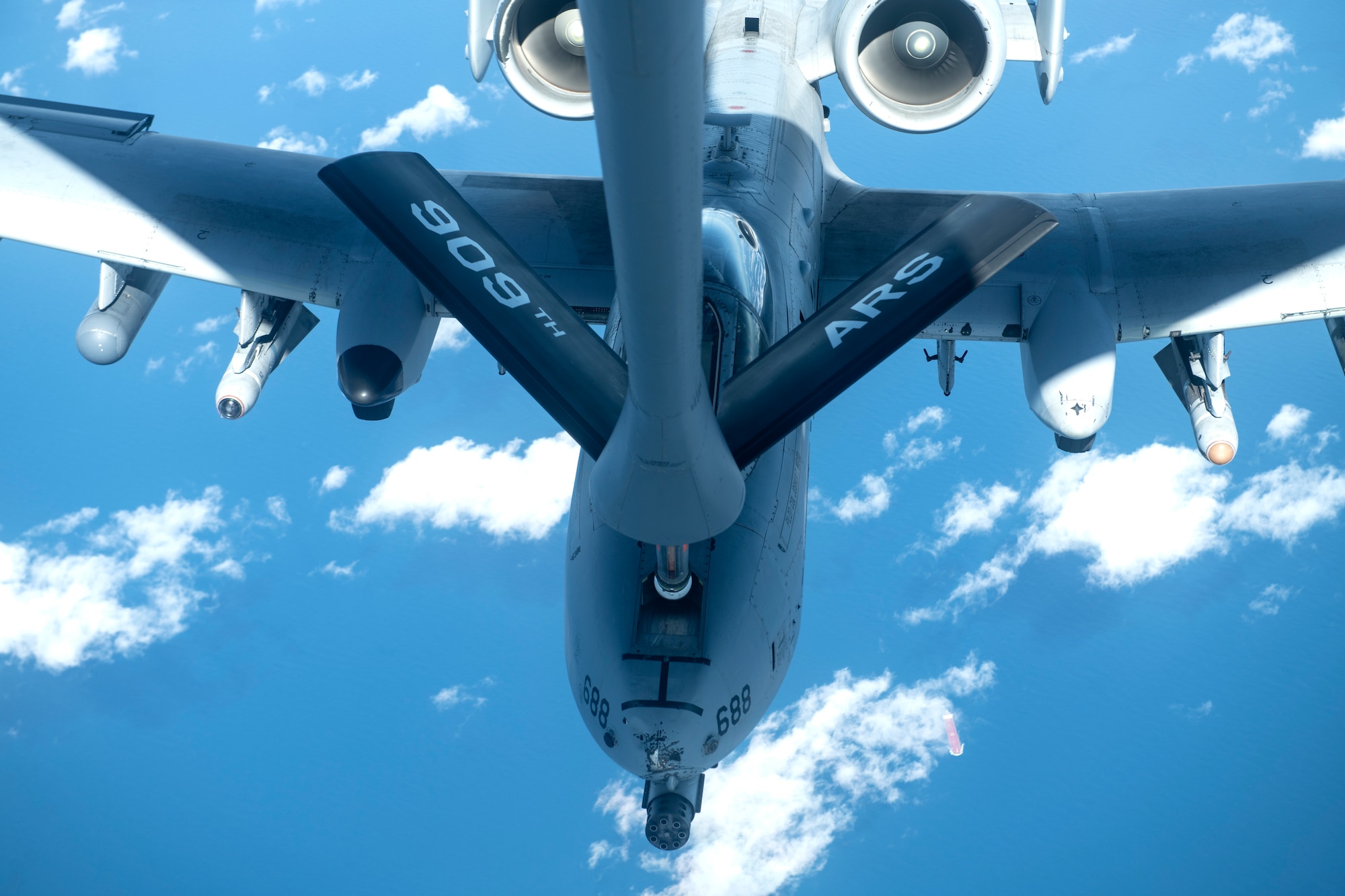 A U.S. Air Force A-10 Thunderbolt II from the 51st Fighter Squadron connects with a 909th Refueling Squadron KC-135 Stratotanker for aerial refueling over the Pacific Ocean Oct. 14, 2021. The 51st FW conducts routine training exercises to maintain the readiness needed to ensure the continued defense of Osan Air Base and the Republic of Korea. (U.S. Air Force photo by Senior Airman Jessi Monte)