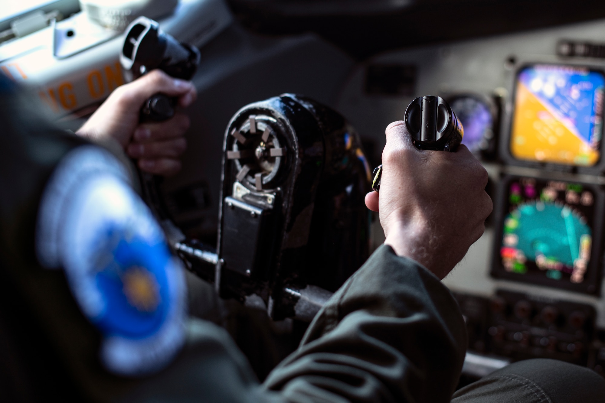 U.S. Air Force Capt. Kemper Peterson, 909th Air Refueling Squadron pilot, guides a KC-135 Stratotanker toward Kadena Air Base, Japan, Oct. 14, 2021. The KC-135 Stratotanker provides the core aerial refueling capability for the U. S. Air Force, also supporting the U.S. Navy, U.S. Marine Corps, and allied nation aircraft. (U.S. Air Force photo by Senior Airman Jessi Monte)