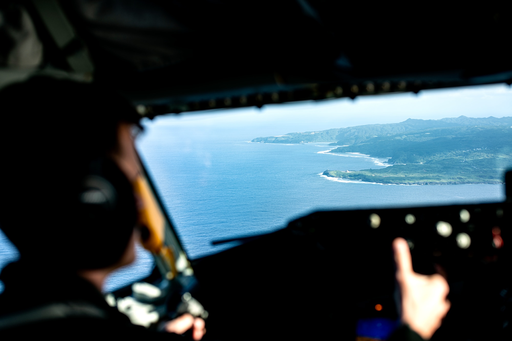 Okinawa prefecture comes into view as a 909th Air Refueling Squadron KC-135 Stratotanker approaches after an aerial refueling mission over the Pacific Ocean, Oct. 14, 2021. Aerial refueling capabilities extend airborne training time and combat radius, ensuring U.S. and allied nation aircraft are postured to maintain regional peace and stability within the Indo-Pacific area of responsibility. (U.S. Air Force photo by Senior Airman Jessi Monte)