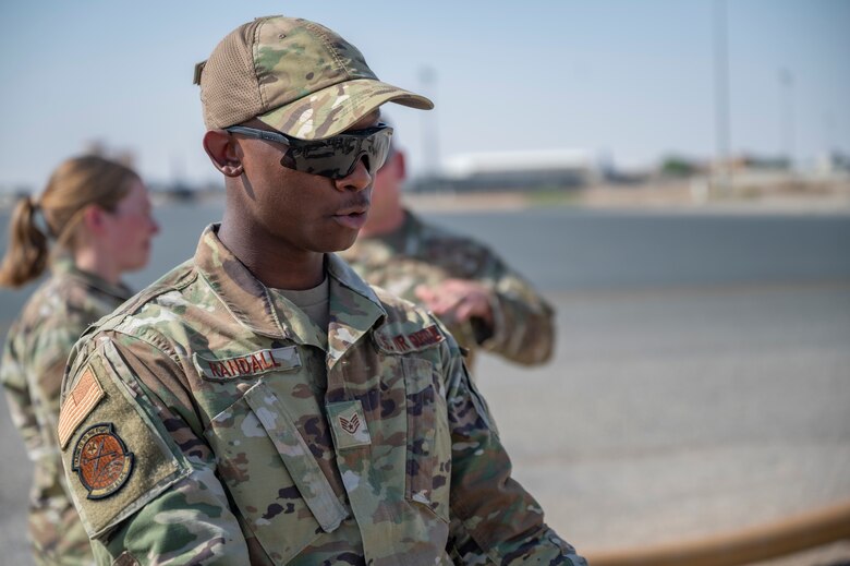 U.S. Air Force Staff Sgt. Raymond Randall, a fuels facility technician assigned to the 386th Expeditionary Logistics Readiness Squadron, discusses fuel operations with Airmen at Ali Al Salem Air Base, Kuwait, on Oct. 15, 2021.