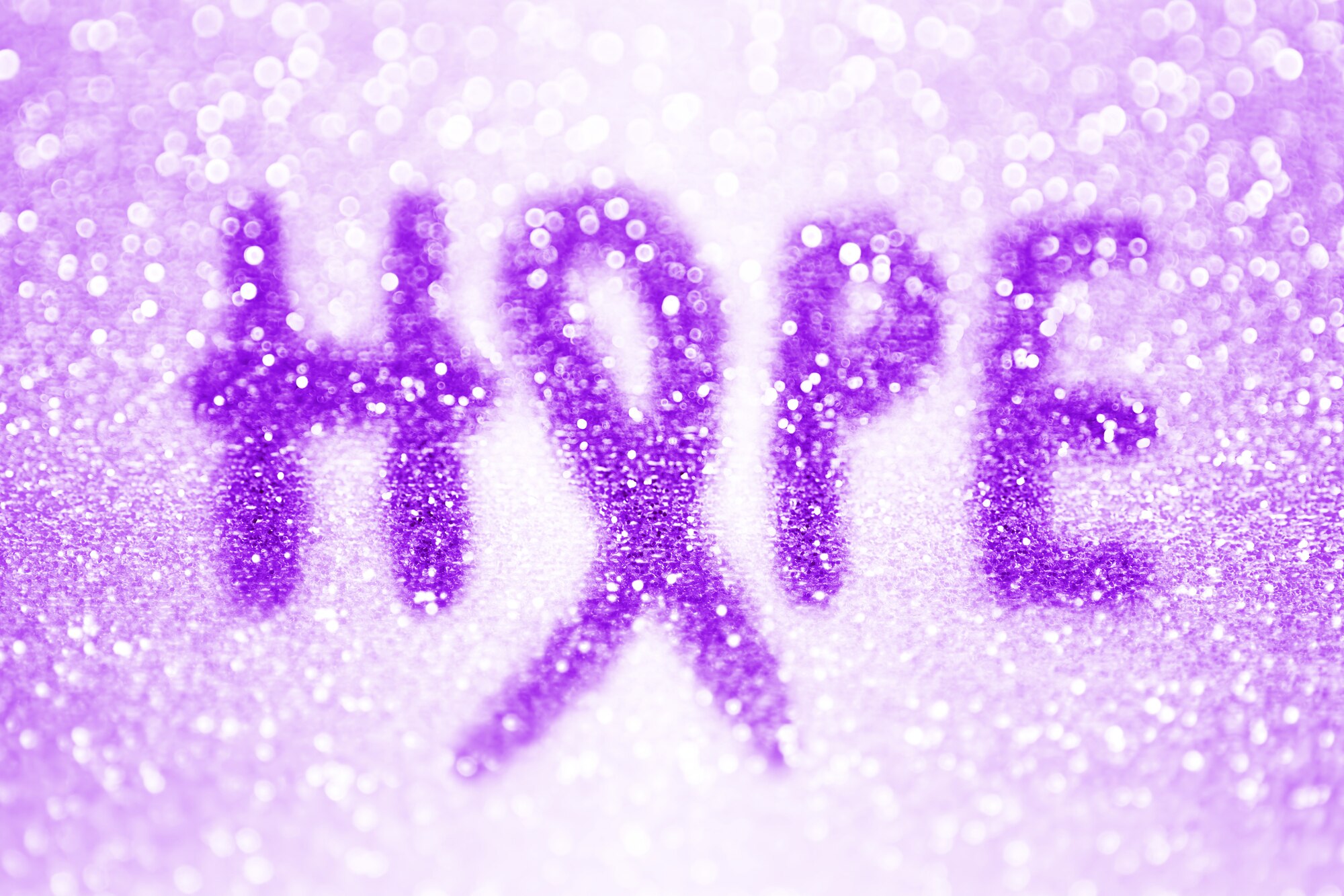 Grpahic says "Hope" with a purple ribbon replacing the "O."