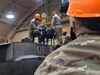 U.S. Soldiers with Bravo Company, 628th Aviation Support Battalion, 28th Expeditionary Combat Aviation Brigade reinstall the main rotor head on a UH-60 Black Hawk helicopter after routine maintenance at an airfield in the 28th ECAB’s area of operations in the Middle East. (U.S. Army photo by Sgt. Francis Calabro)