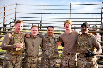 Airmen from the 423rd Security Forces Squadron, pose for a photo after completing a defender challenge at RAF Alconbury, England, Oct. 13, 2021. The challenge was part of National Police Week where defenders paid homage to those who have served as police officers and to honor those that lost their lives in the line of duty. (U.S. Air Force photo by Senior Airman Eugene Oliver)