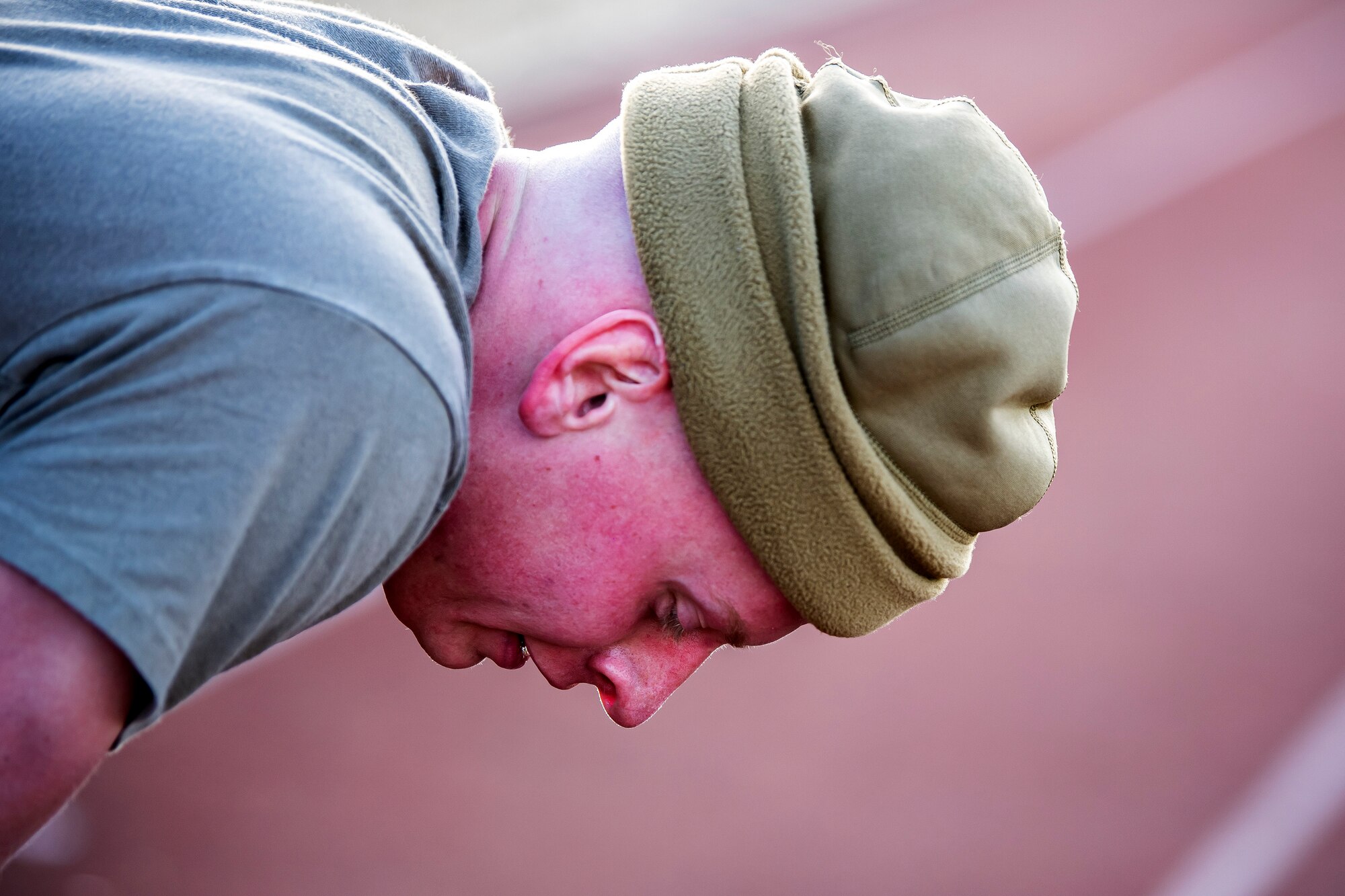 Senior Airman Stone Kraft, 423rd Security Forces Squadron installation patrolman, catches his breath after completing a defender challenge at RAF Alconbury, England, Oct. 13, 2021. The challenge was part of National Police Week where defenders paid homage to those who have served as police officers and to honor those that lost their lives in the line of duty. (U.S. Air Force photo by Senior Airman Eugene Oliver)