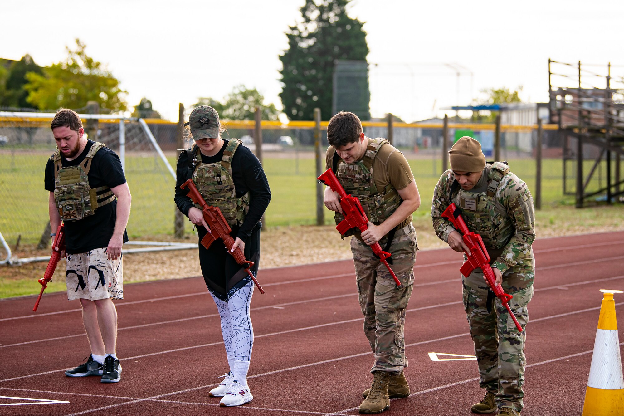 Participants from the 423rd Security Forces Squadron prepare to run as part of a defender challenge at RAF Alconbury, England, Oct. 13, 2021.  The challenge was part of National Police Week where defenders paid homage to those who have served as police officers and to honor those that lost their lives in the line of duty. (U.S. Air Force photo by Senior Airman Eugene Oliver)