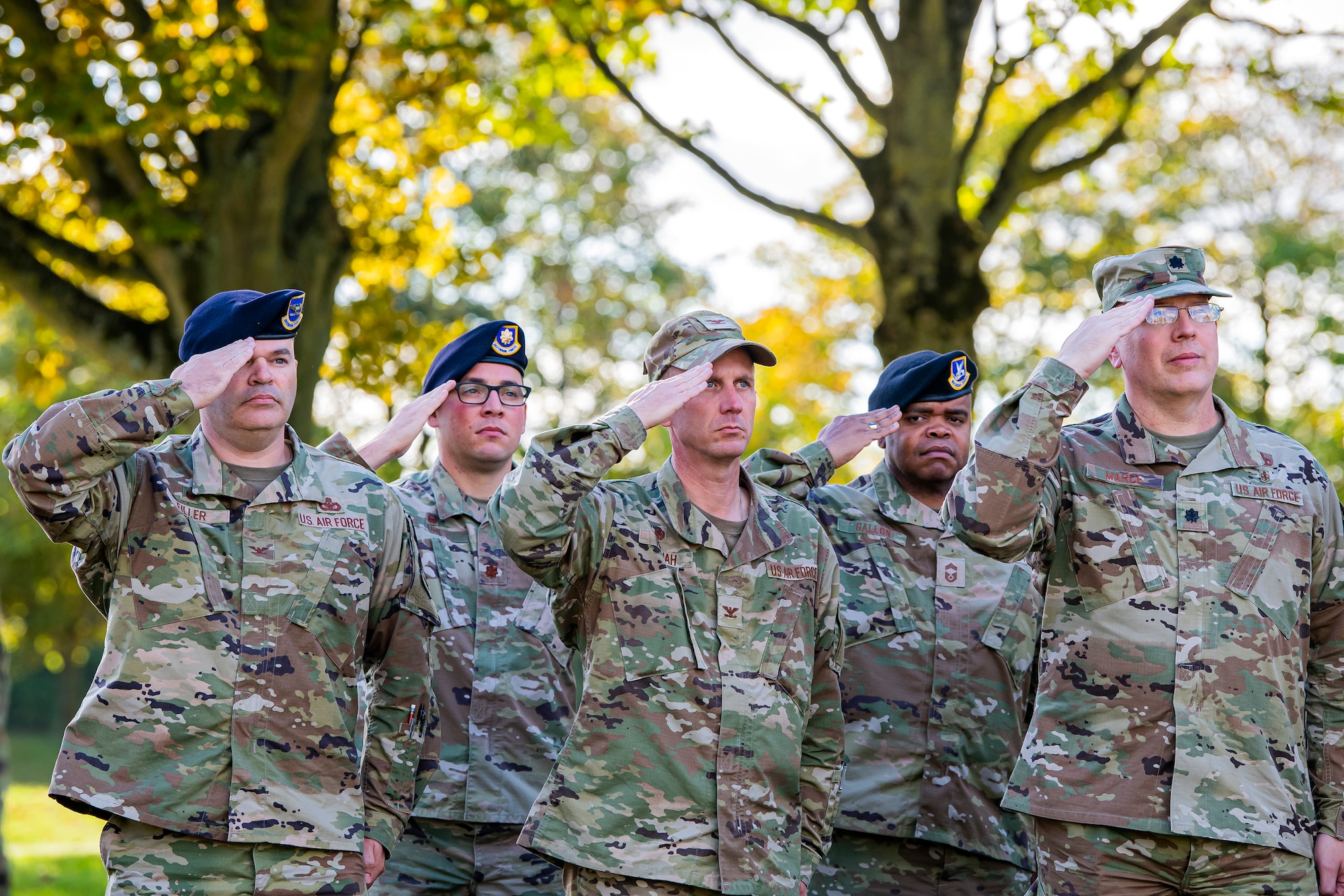 Leadership from the 501st Combat Support Wing and 422d Air Base Group salute during a retreat ceremony at RAF CRoughton, England, Oct. 15, 2021. The ceremony concluded Police Week in which defenders from the 422d and 423rd Security Forces Squadrons paid homage to those who lost their lives in the line of duty. (U.S. Air Force photo by Senior Airman Eugene Oliver)