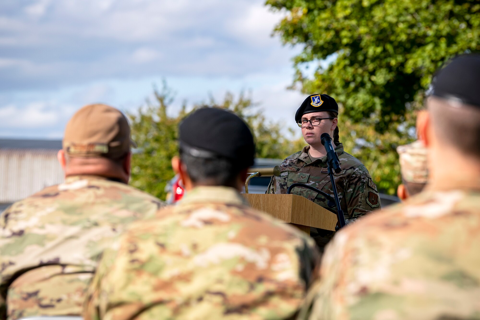 Senior Airman Maysi Pratt-Hill, 422d Security Forces Squadron resource advisor, speaks during a retreat ceremony at RAF Croughton, England, Oct. 15, 2021. The ceremony concluded Police week in which defenders from the 422d and 423rd SFS paid homage to those who lost their lives in the line of duty. (U.S. Air Force photo by Senior Airman Eugene Oliver)