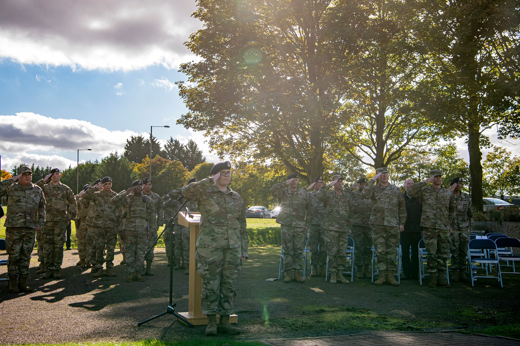 Airmen from the 501st Combat Support Wing salute during a retreat ceremony at RAF Croughton, England, Oct. 15, 2021.  The ceremony concluded Police week in which defenders from the 422d and 423rd Security Forces Squadrons paid homage to those who lost their lives in the line of duty. (U.S. Air Force photo by Senior Airman Eugene Oliver)