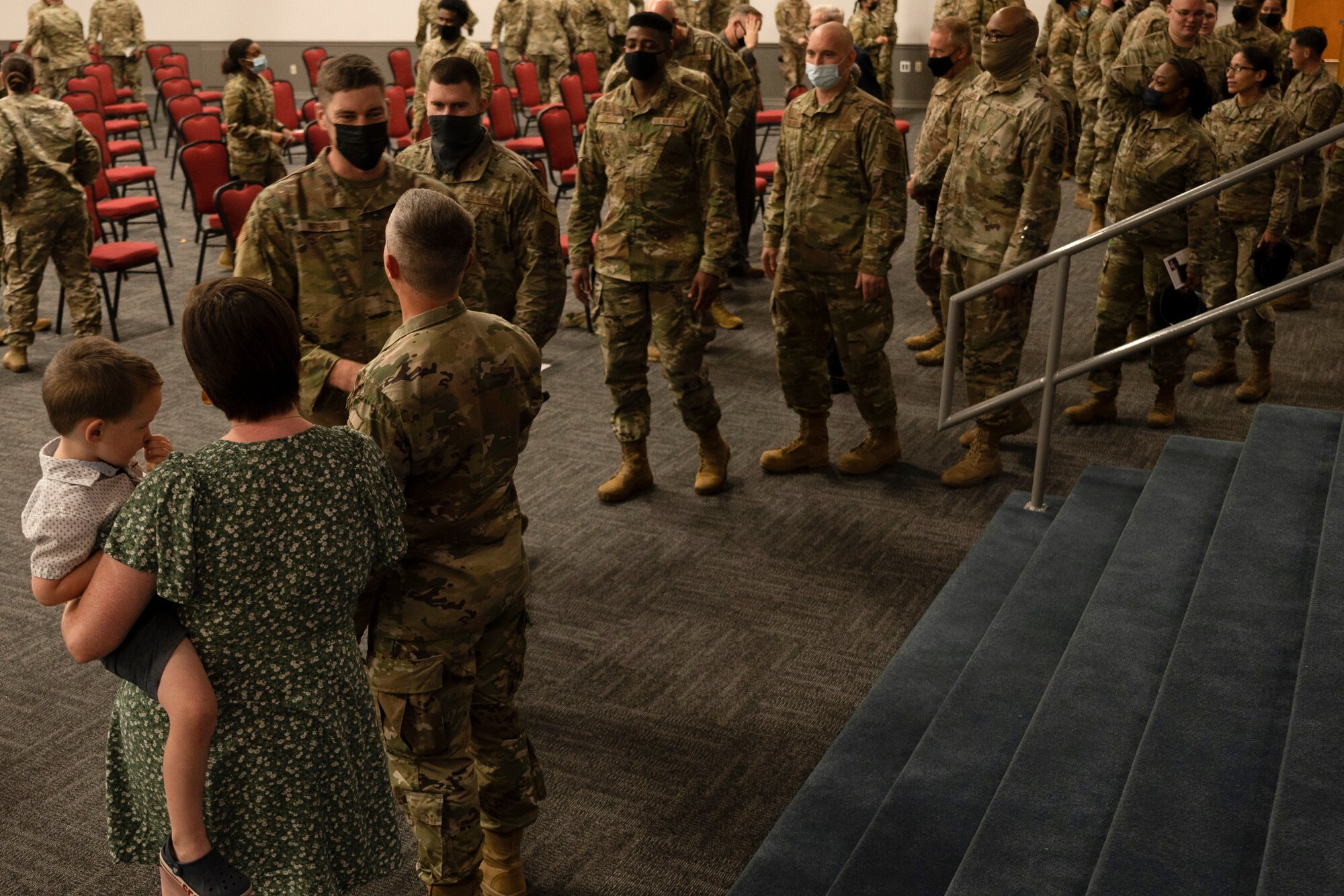 Airmen stand in line.