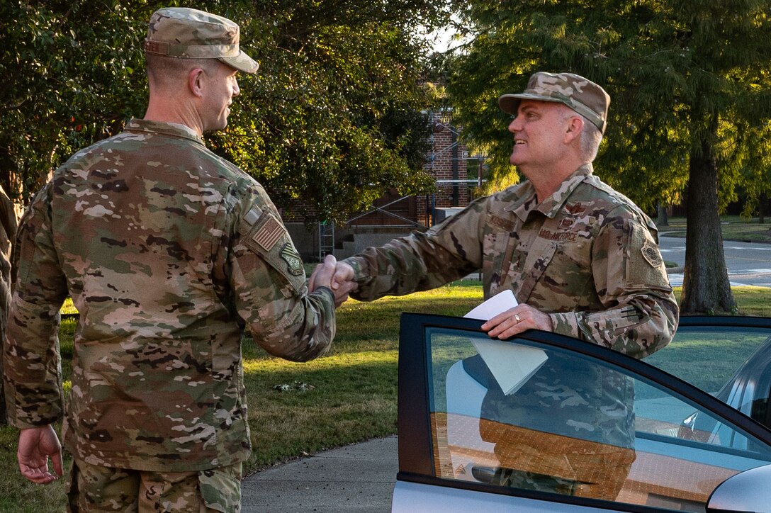 U.S. Air Force Col. William Creeden (left), 1st Fighter Wing commander, greets Maj. Gen. Michael G. Koscheski, Fifteenth Air Force commander,