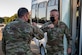 Lt. Col. Nicholas Sigler (left), 1st Operations Support Squadron commander, greets Maj. Gen. Michael G. Koscheski, Fifteenth Air Force commander