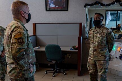 U.S. Air Force Maj. Gen. Michael G. Koscheski (left), Fifteenth Air Force commander is briefed by Tech. Sgt. Tyrome Conyers