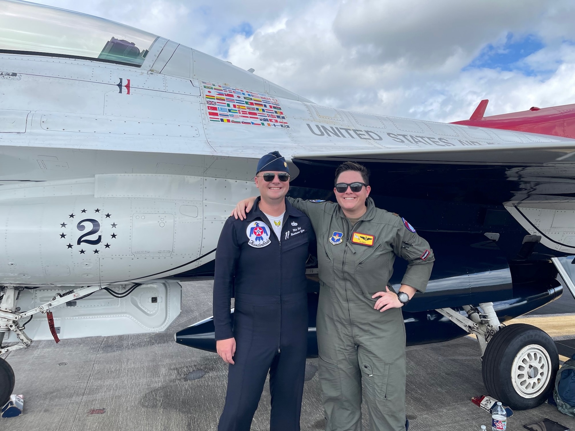 Maj. Kiersten “CLICKS” Thompson poses for a photo with her friend Maj. Mike Ball, a U.S. Air Force Thunderbird maintenance officer, at the Wings Over Houston Airshow in Houston, Texas, Oct. 10, 2021.