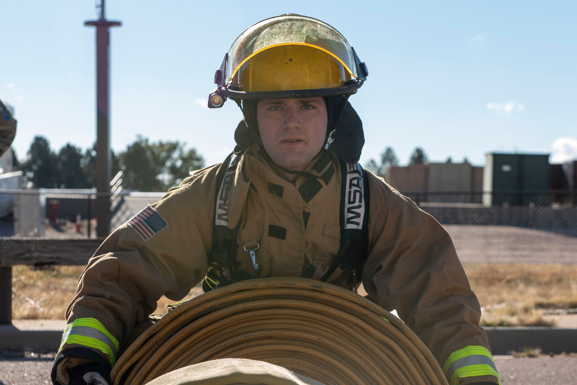 A firefighter posing for a photo