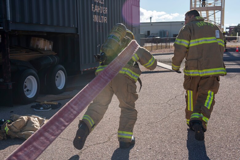 Firefighter participating in obstacle course