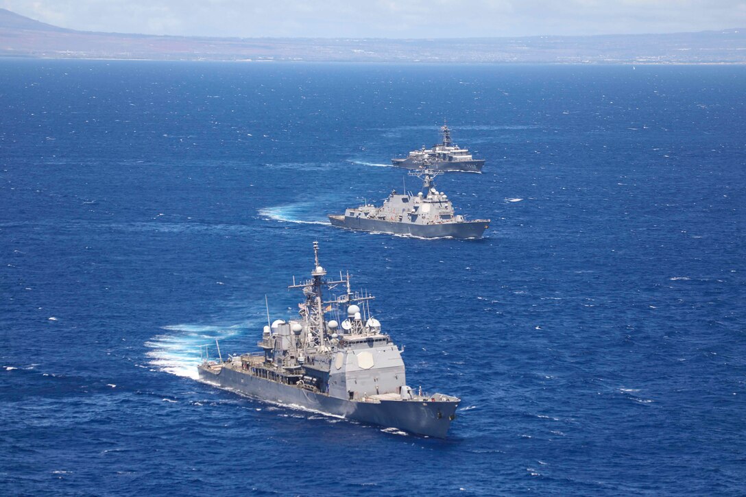Three ships sail in formation.
