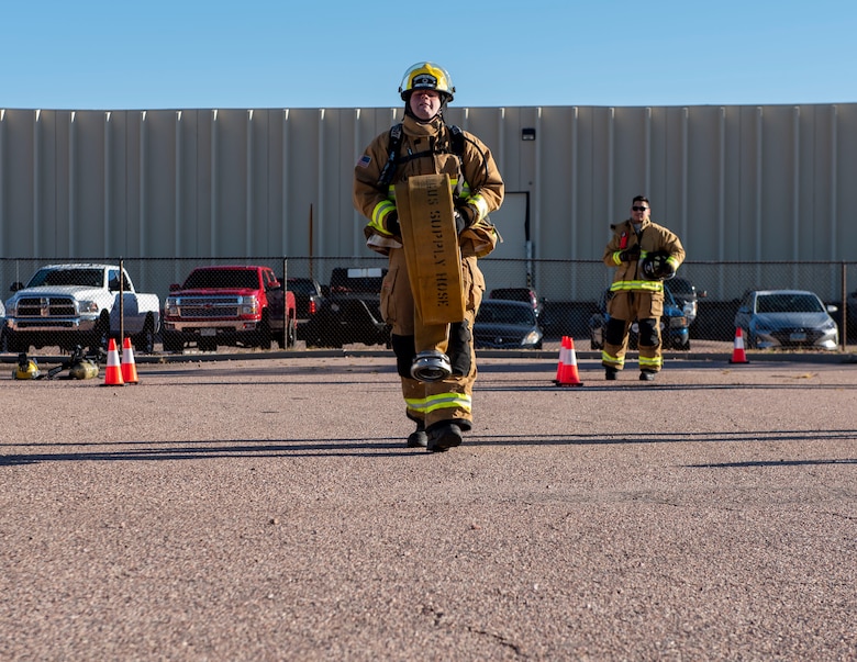 Firefighter participating in obstacle course