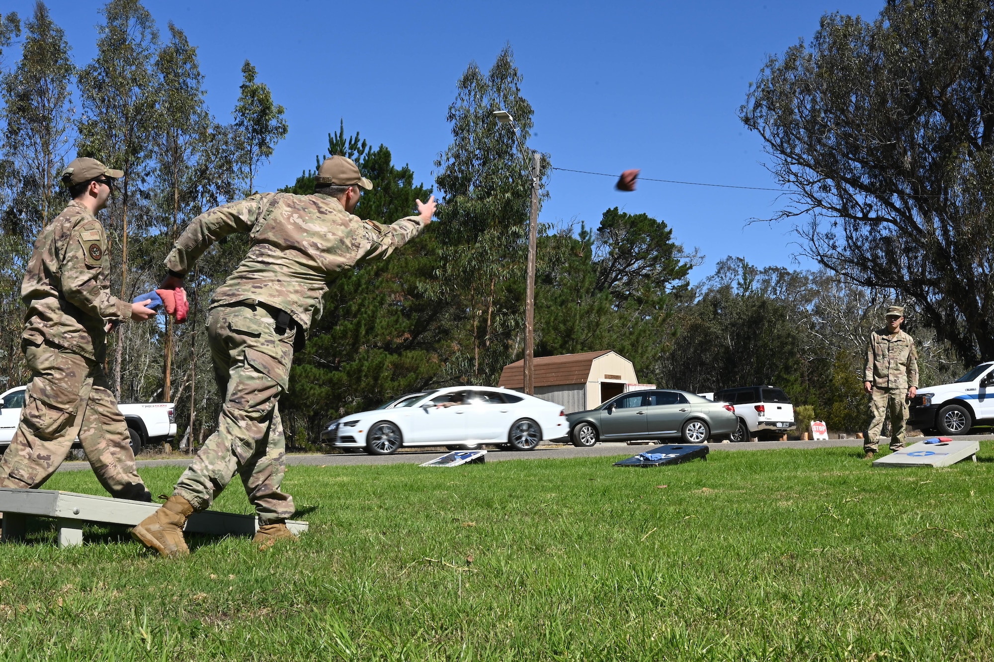 Military members play cornhole