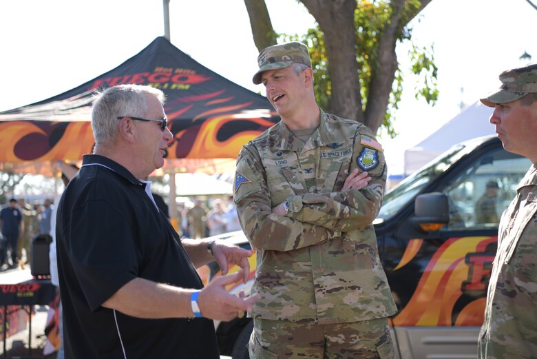 U.S. Space Force Col. Robert Long, Space Launch Delta 30 commander, talks with one of the volunteers of the Veteran’s Stand Down Day event at Santa Maria Fair Park in Santa Maria, Calif., October 16, 2021. Hundreds of volunteers gather each year for the four-hour event to provide goods and services to local veterans. (U.S. Space Force photo by Airman Kadielle Shaw)
