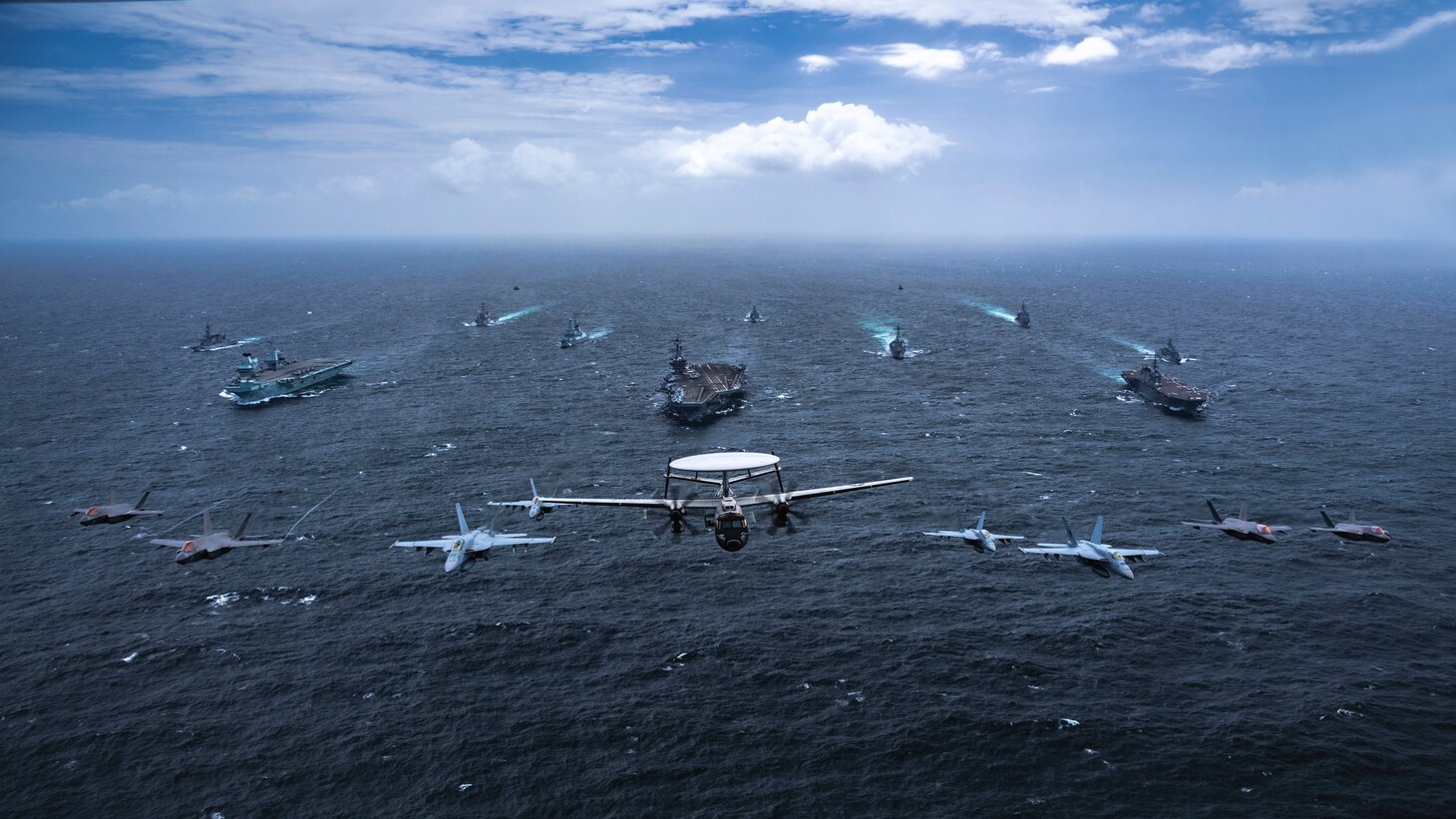 BAY OF BENGAL (Oct. 17, 2021) Ships and aircraft from the U.S. Navy, Royal Australian Navy, Japan Maritime Self-Defense Force, and U.K. Royal Navy transit in formation as part of Maritime Partnership Exercise (MPX) 2021, Oct. 17, 2021. MPX 2021 is a multilateral maritime exercise between the Royal Australian Navy, Japan Maritime Self-Defense Force, U.K. Royal Navy, and U.S. maritime forces, focused on naval cooperation, interoperability and regional security and stability in the Indo-Pacific and is an example of the enduring partnership between Australian, Japanese, U.K. and U.S. maritime forces, who routinely operate together in the Indo-Pacific, fostering a cooperative approach toward regional security and stability. (U.S. Navy photo by Mass Communication Specialist 2nd Class Haydn N. Smith)