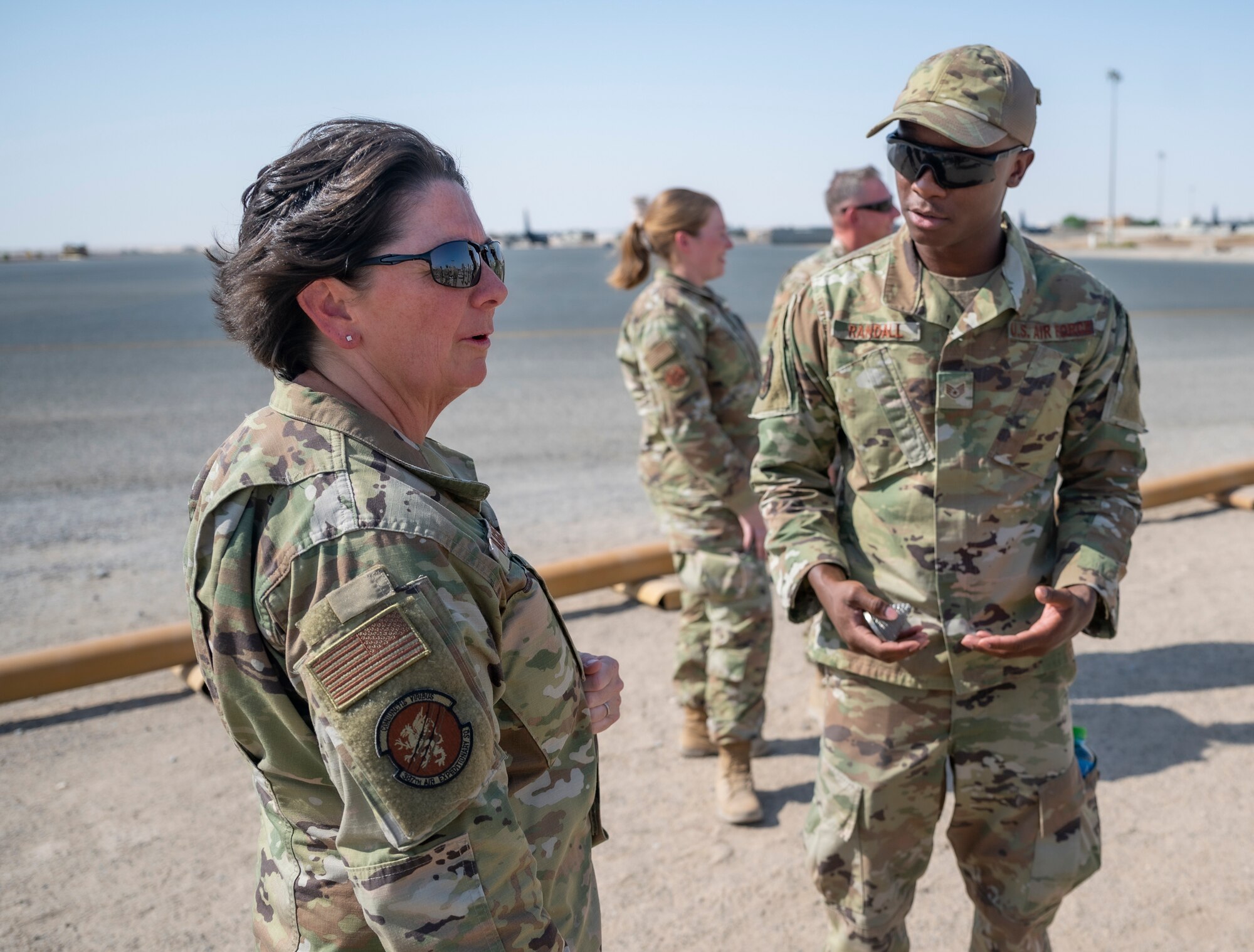 U.S. Air Force Staff Sgt. Raymond Randall, a fuels facility technician assigned to the 386th Expeditionary Logistics Readiness Squadron, discusses fuel operations with Chief Master Sgt. Jeanne Daigneau, senior enlisted advisor assigned to the 387th Air Expeditionary Squadron, at Ali Al Salem Air Base, Kuwait, on Oct. 15, 2021.