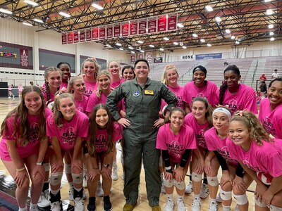 Photo of Maj. Kiersten “CLICKS” Thompson with members of the Pearland High School volleyball team Oct. 8, 2021 in Texas.