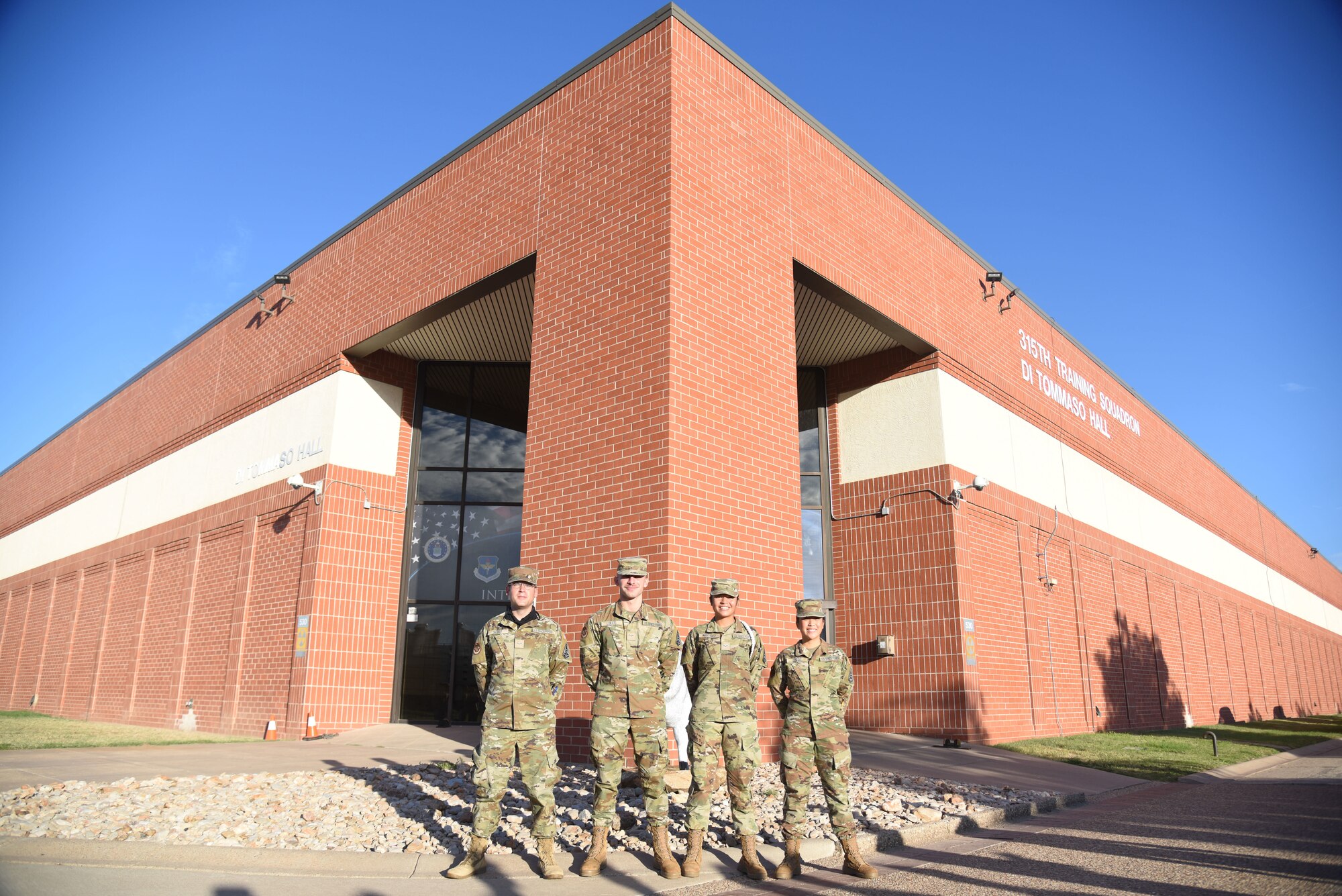 Four U.S. Space Force Guardians assigned to the 315th Training Squadron pose for a group photo on Goodfellow Air Force Base